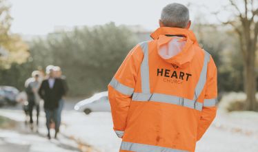 a man dressed in heart church high visibility clothing
