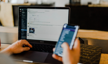 person using mobile and desktop to connect